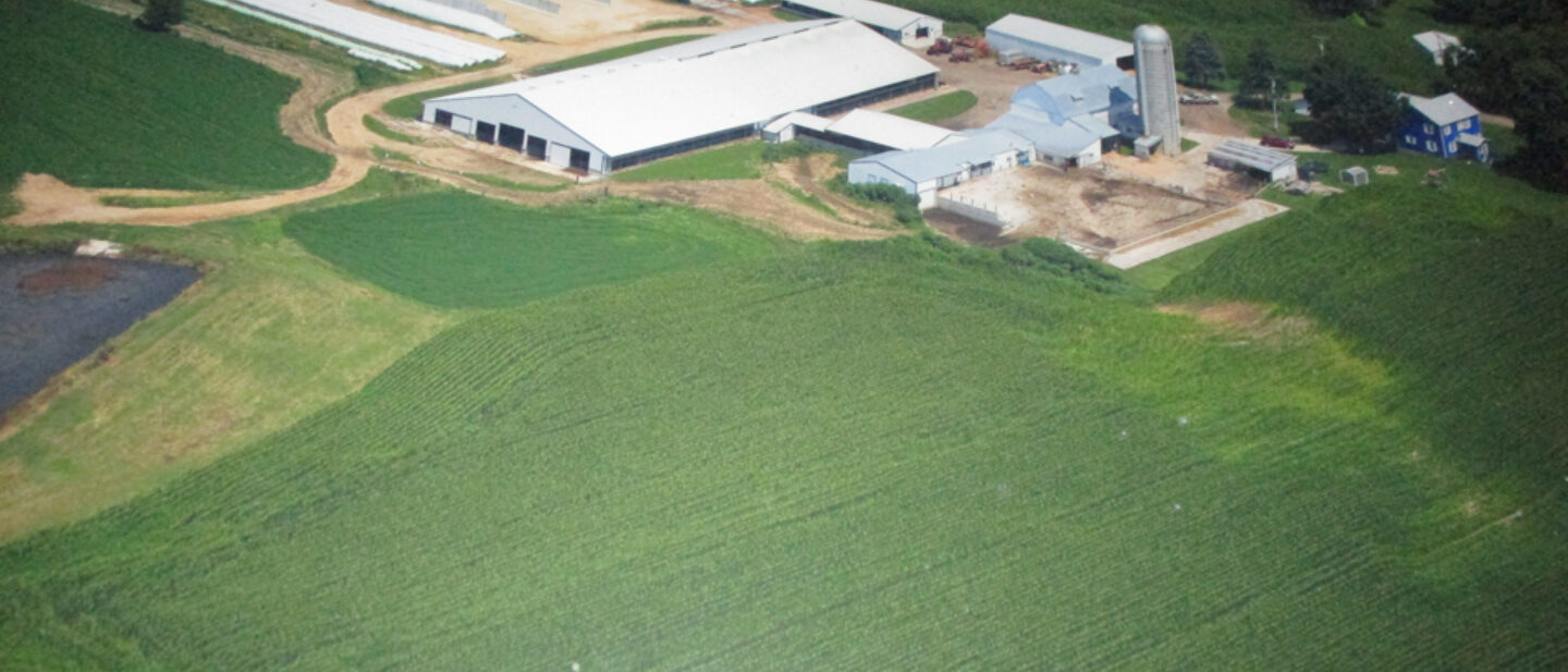 Aerial view of home and buildings