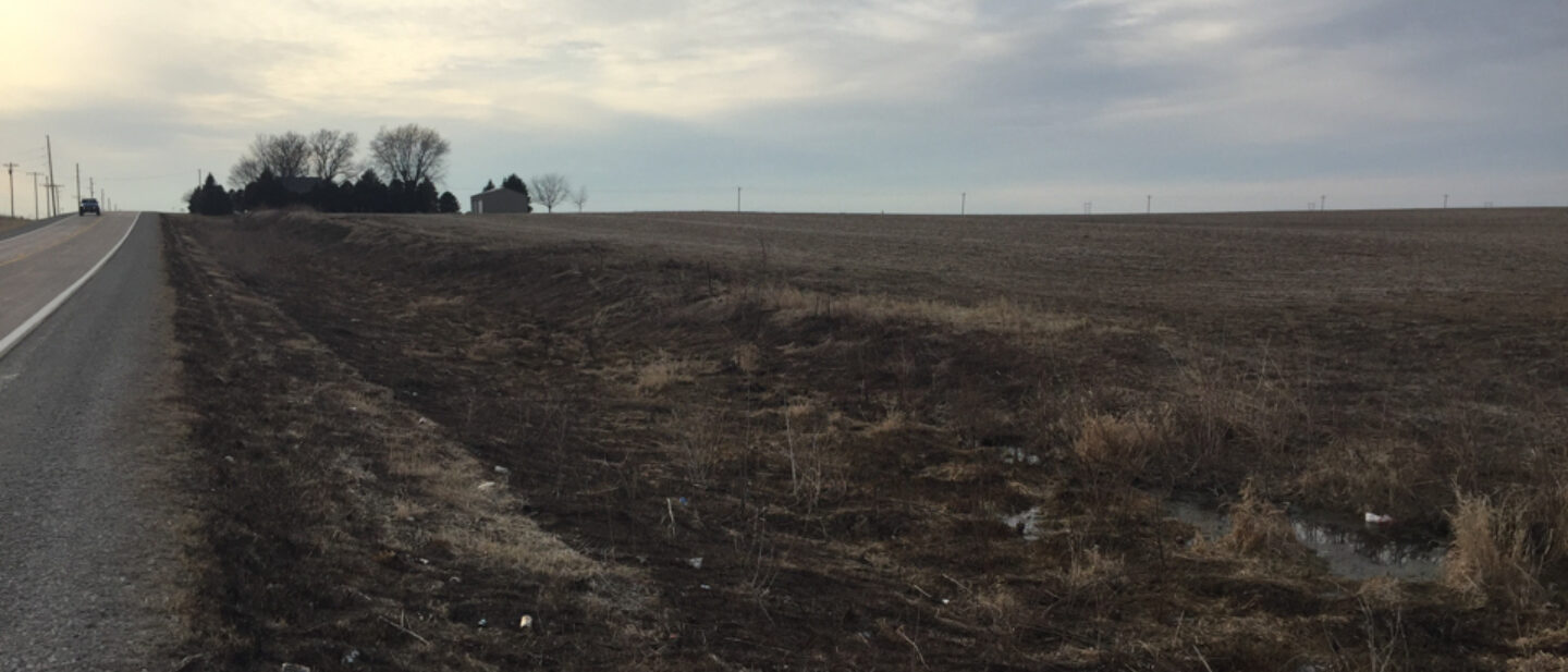 From south paved road near west former waterway looking west